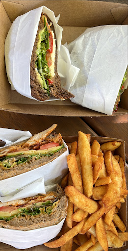 Fresh sandwiches and chips in a takeaway box